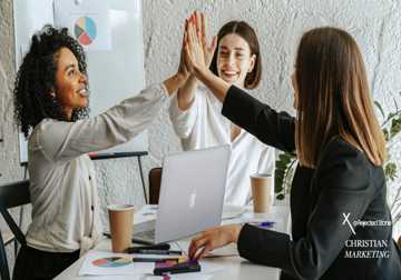 Three woman entrepreneurs celebrating a win